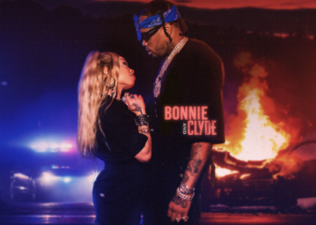 Promotional cover image for the song "Bonnie & Clyde" by artists Honey Bxby and Fivio Foreign. The image features both artists standing close together with a fiery explosion and overturned cars in the background. Both artists are dressed in stylish, urban outfits. Honey Bxby is holding a microphone while Fivio Foreign has several chains around his neck. The title "Bonnie & Clyde" is prominently displayed at the top in bold, stylized text.