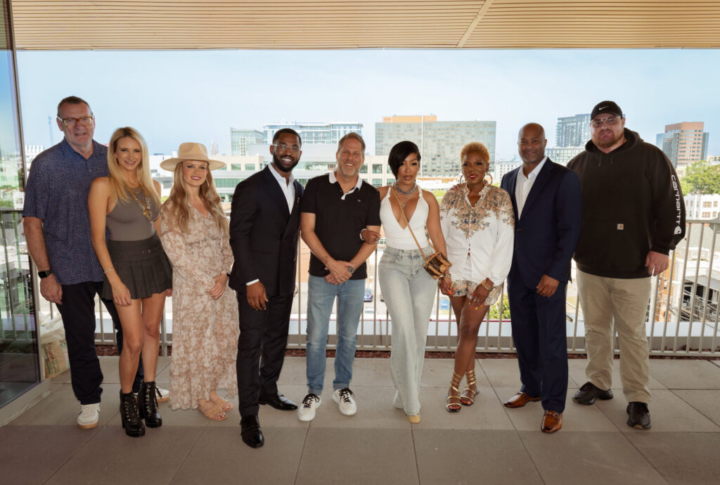 K. Michelle pictured with BMG Nashville and BBR Music Group team members for her new record deal for her country album.