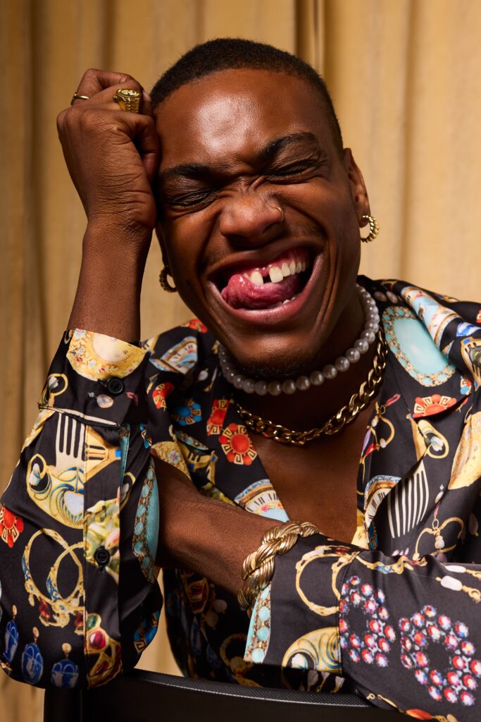 A photo of R&B singer Langston Bleu smiling wide