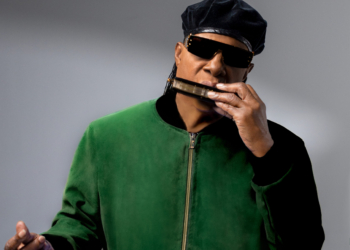 A photo of Stevie Wonder playing the harmonica
