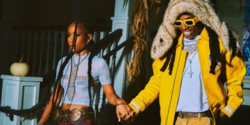 A photo of DeJ Loaf and Jacquees holding hands