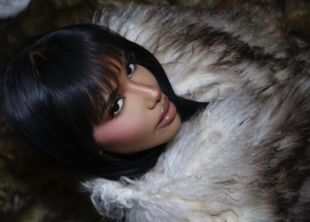 A photo of Chxrry22 wearing a fur coat