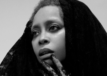 A black and white photo of Erykah Badu