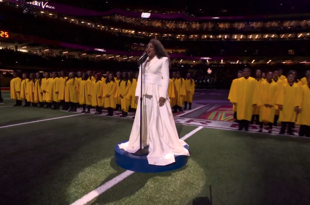 Ledisi with a New Orleans youth choir at the Super Bowl LIX pregame show.
