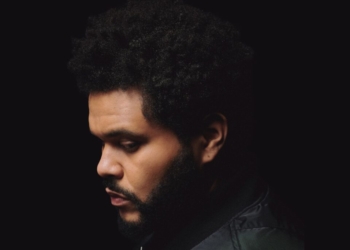 A photo of The Weeknd against a black backdrop.