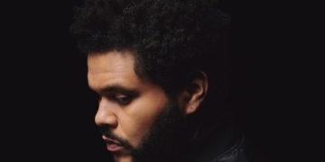 A photo of The Weeknd against a black backdrop.