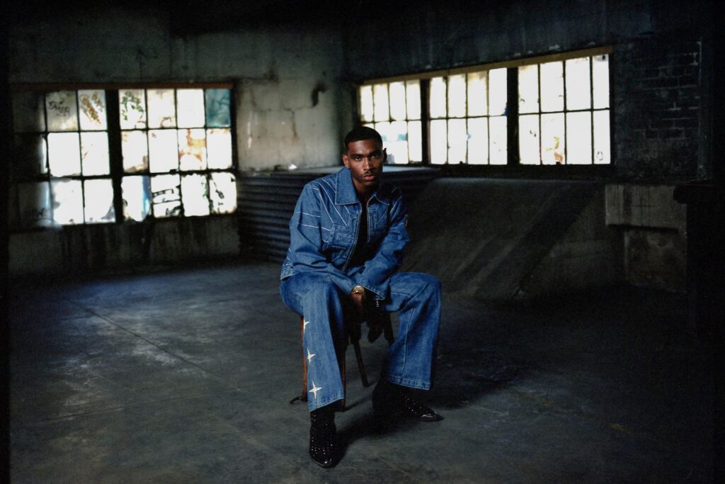 A photo of Jordan Hawkins wearing a denim outfit
