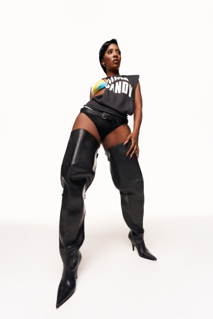 A photo of Tiwa Savage against a white backdrop