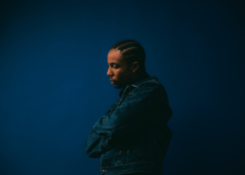 A photo of Ebubé against a blue backdrop