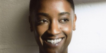 A photo of singer Syd smiling