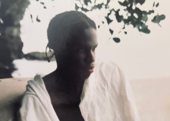 A photo of Daniel Caesar wearing white