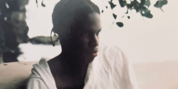 A photo of Daniel Caesar wearing white