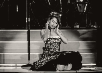 RAYE performing on stage