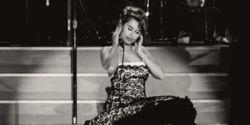 RAYE performing on stage