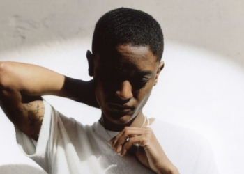 A photo of Syd against a white wall