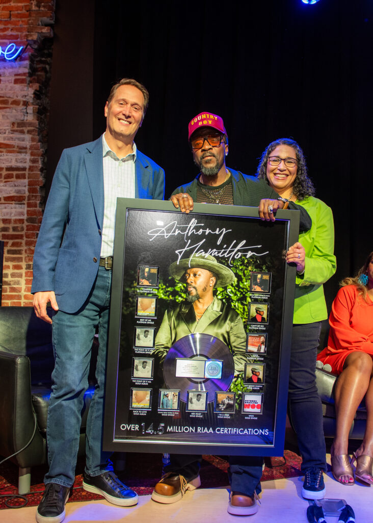 A photo of Anthony Hamilton and RIAA's Mitch Glazier and Michele Ballantyne.