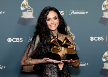 Kehlani poses with her two statuettes at the 68th Grammy Awards.