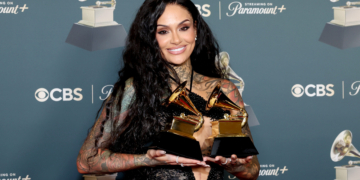 Kehlani poses with her two statuettes at the 68th Grammy Awards.