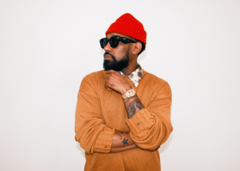 A photo of PJ Morton against a wall