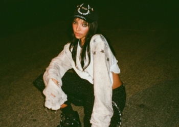 A photo of Tinashe outside at night