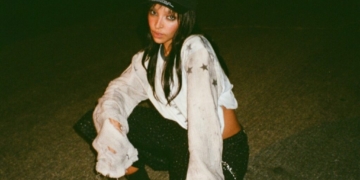 A photo of Tinashe outside at night