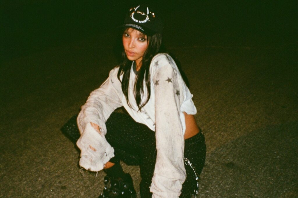A photo of Tinashe outside at night